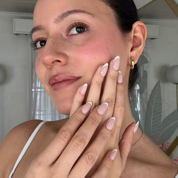 Woman with french tip nails.